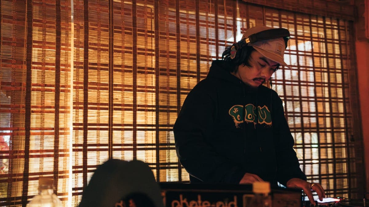 DJ mixing at the turntables at KohBar