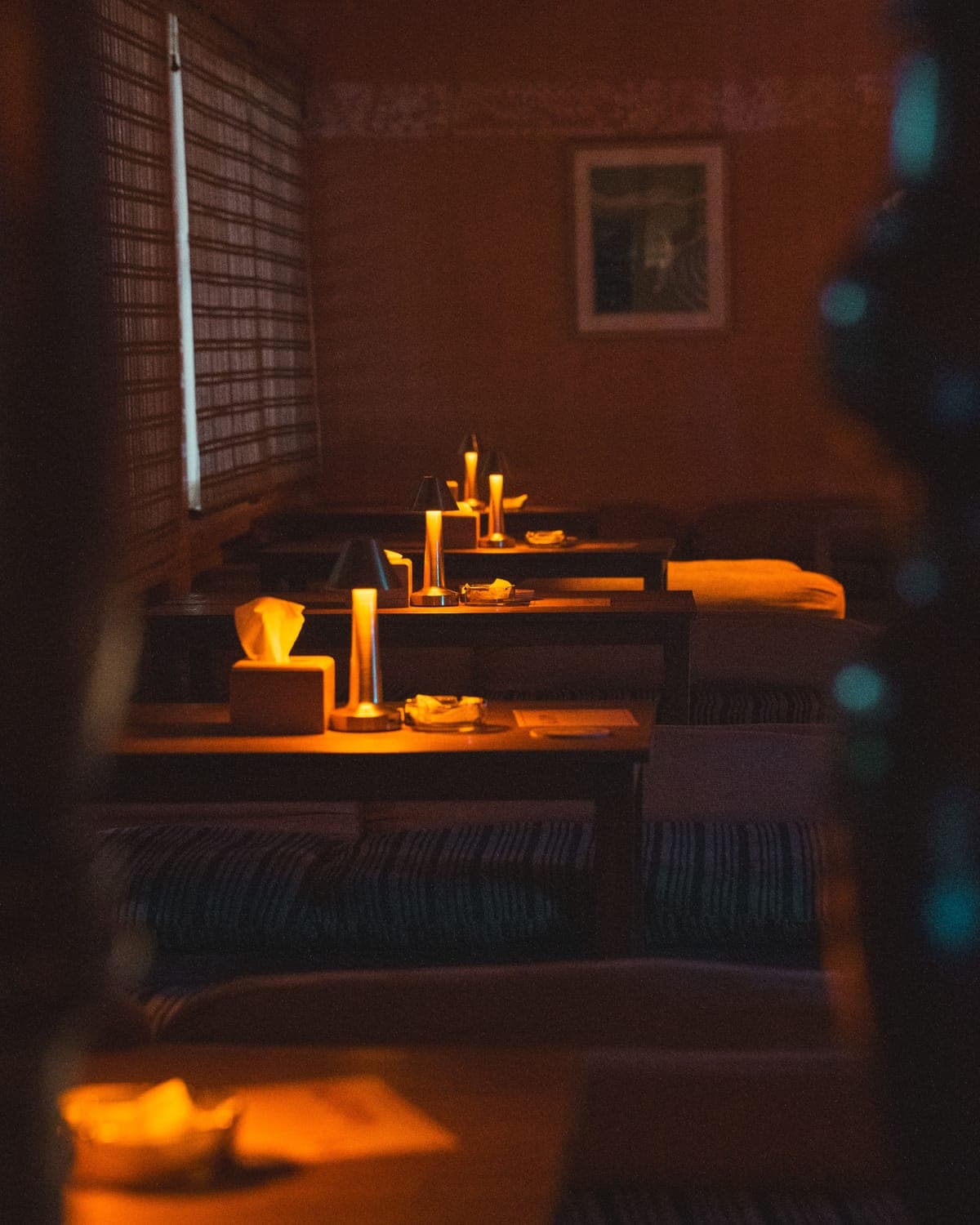 Intimate candlelit table setting at KohBar