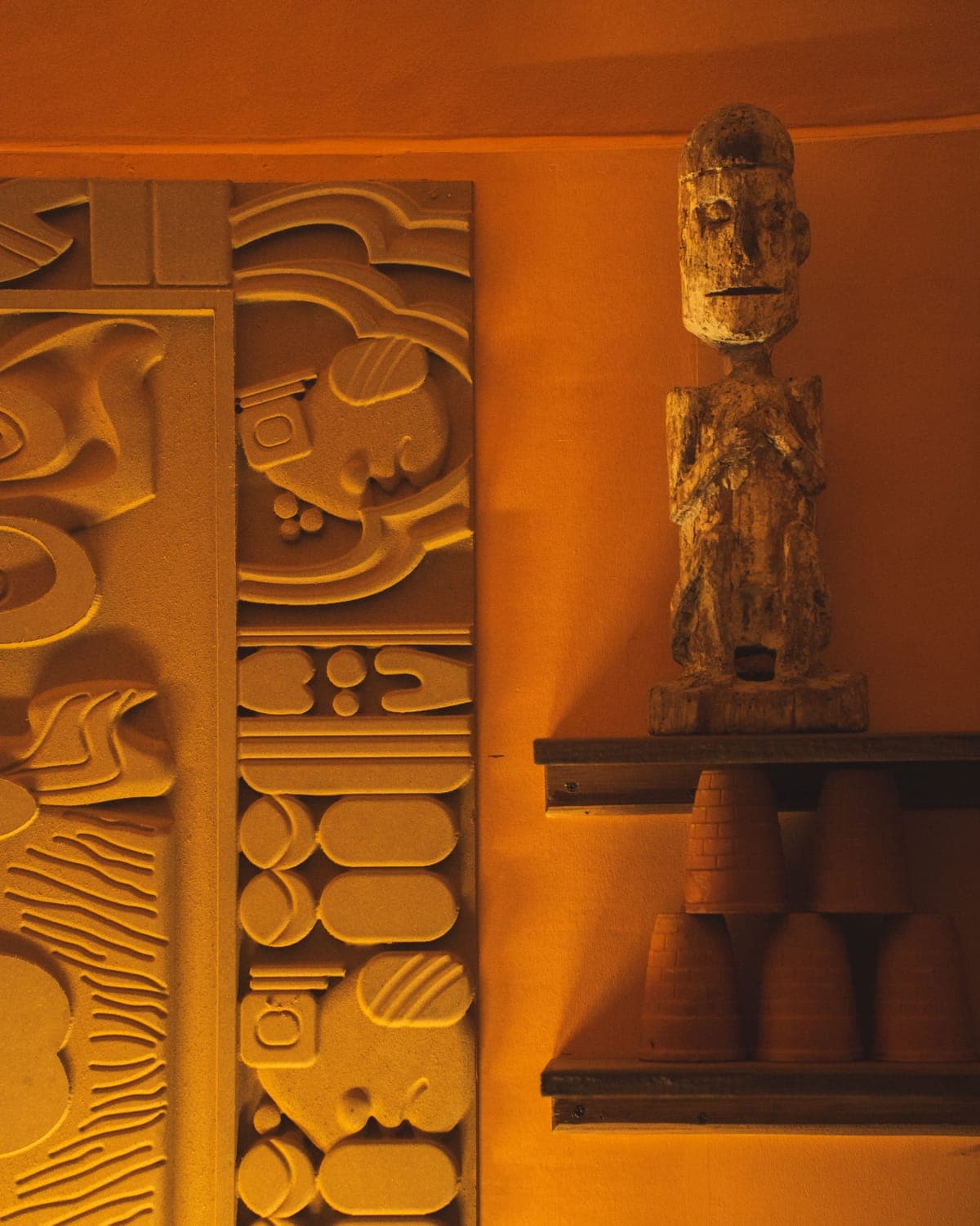 Carved wooden column and tiki figure at KohBar