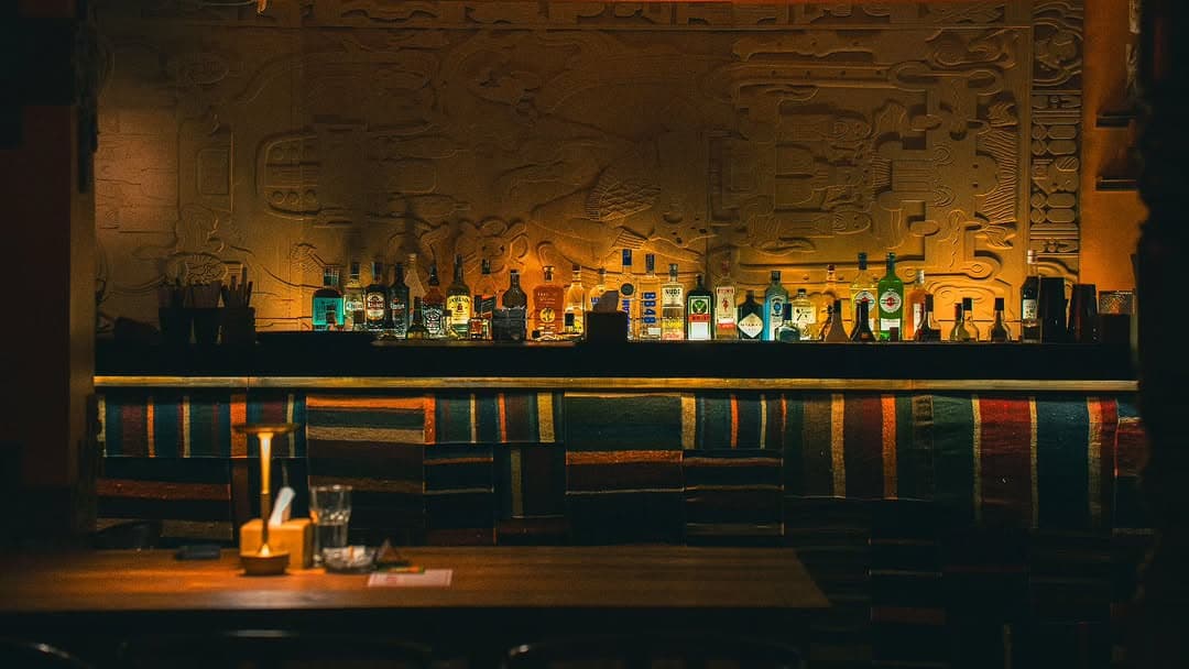 KohBar Tiki Bar interior with warm amber lighting and guests in Thamel, Kathmandu